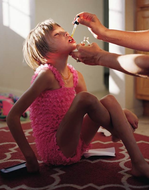 Lily Rowland receives a dose of oil deeriieved from cannabidiol (CBD)